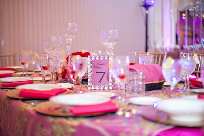 Gold and fuchsia wedding decor table